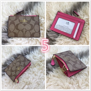 Monedero coach rosa hot sale